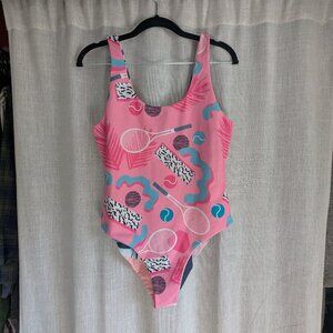 Reversible medium pink one-piece bathing suit with geometric designs